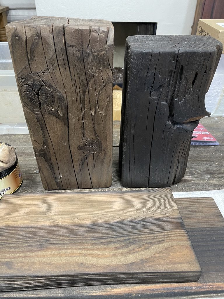 A raw timber block beside a charred block