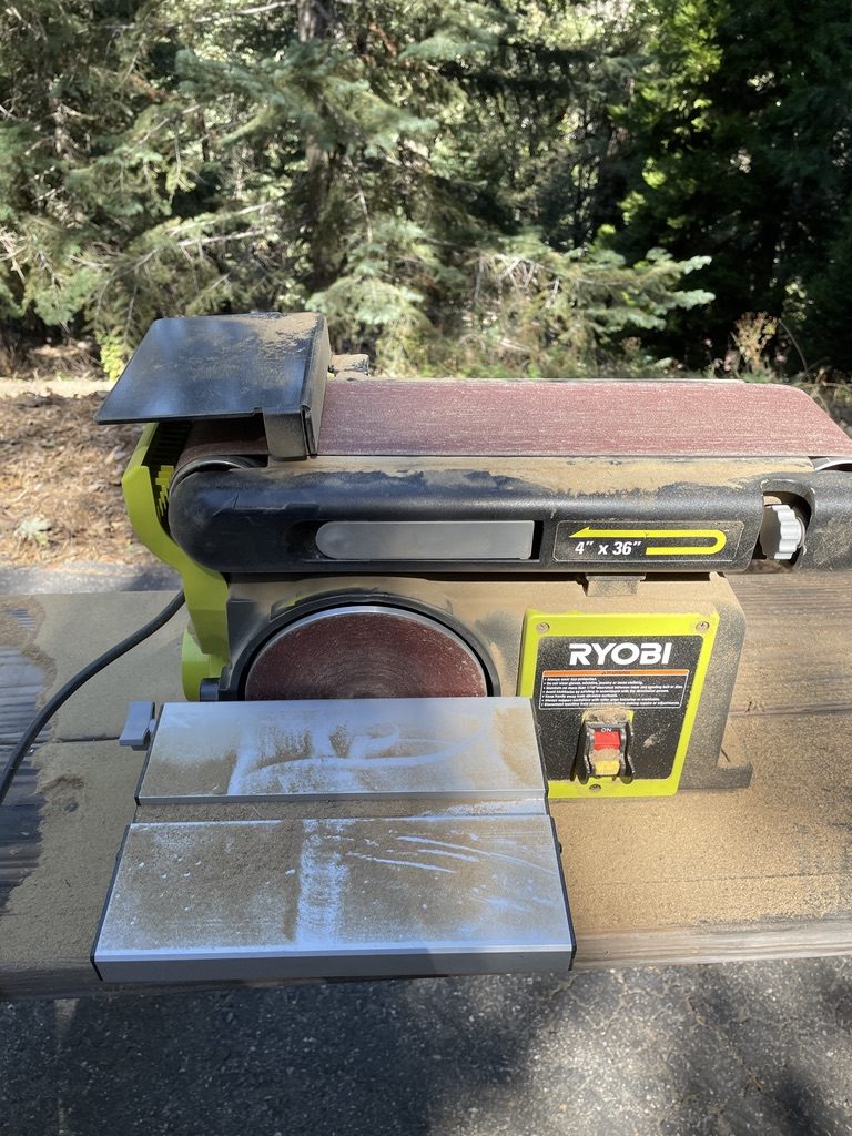 Sawdust-covered belt sander