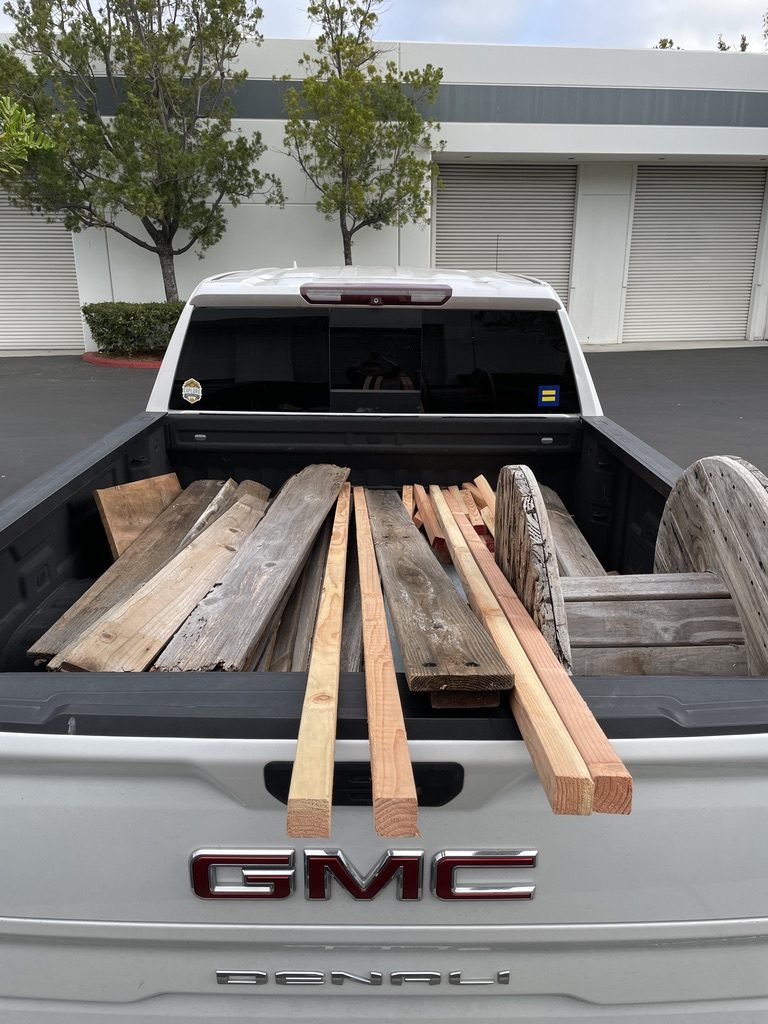 Pickup bed full of salvaged boards