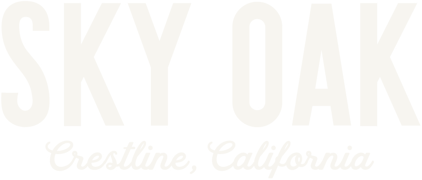 Sky Oak light wordmark with Crestline, California script